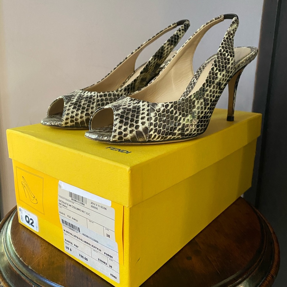 Fendi Snakeskin peep toe heels.